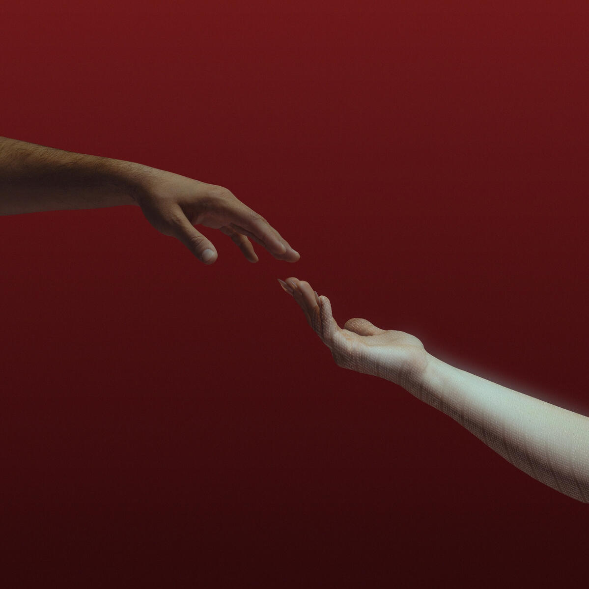 Woman's hand against a red backdrop, with binary code on her arm